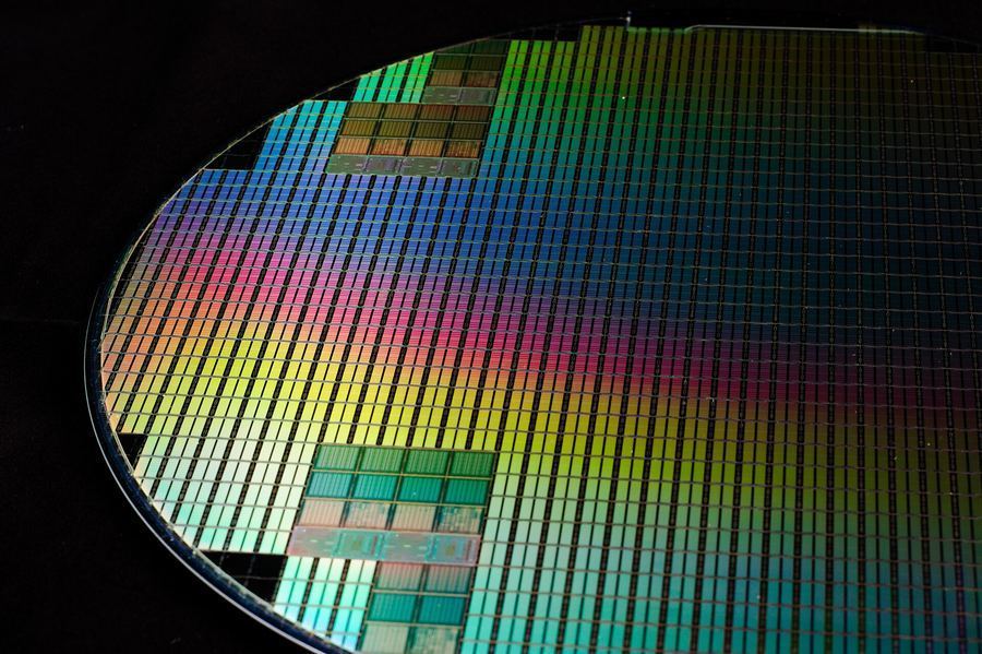 A silicon wafer patterned with hundreds of chips, United States